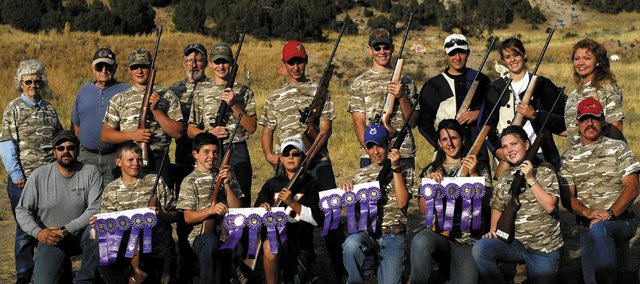The Moffat County 4-H shooting team and coaches returned from the state shooting tournament with more than a handful of ribbons. The team is: front row, from left, coach Steve Sloan, Curtis Tuck, Wes Chapman, Natasha Sloan, Parker Hagins, Miranda Blomquist, Austin Lee and coach Jody Lee; back row, from left, coach Dee Dejong, coach Bob Aaberg, Mark Tuck, coach Don Dejong, Justin Willems, Derek WIllshire, Austin Blomquist, Kody Fox, Lindsey Yoast and Red Lee.