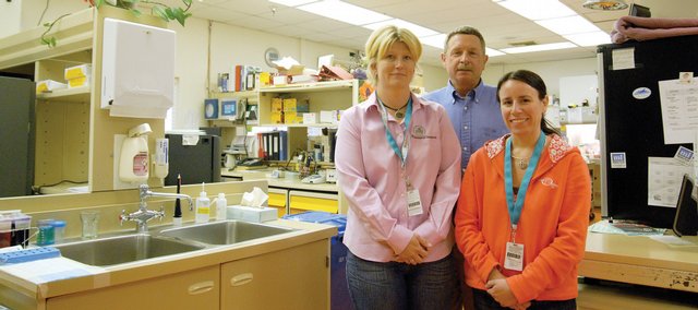 The Memorial Hospital employees, from left, Kristine Cooper, lab manager, Dr. Robert Collins and Marie Etzler, lab supervisor, stand in the current lab at the hospital, which will be switching June 24 to the Mayo Medical Laboratories for outside testing. The trio traveled in May to the world-renowned Mayo Clinic in Rochester, Minn., to see where they would be sending lab work in the future.