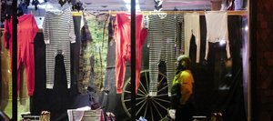 Steamboat Springs resident Douglas James Nielsen walks past an F.M. Light and Sons window display Thursday evening. The Mainstreet Steamboat Springs organization again is encouraging people to do their holiday shopping locally.
