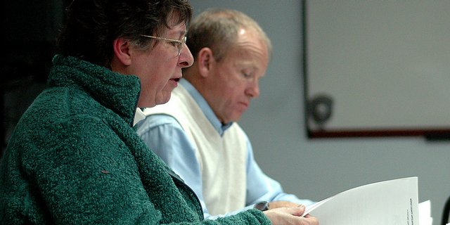 Colorado Northwestern Community College Board of Control Treasurer Karol Bullen looks over the numbers for the college's audit by Colorado CPA Services. The numbers in the audit have been incorrect and unable to be passed for two board meetings, which led to concern from board members at the monthly meeting Monday night. Next to Bullen is Gene Bilodeau, the college's newly appointed vice president of administration.