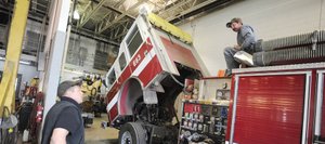 City of Steamboat Springs Public Works head mechanic Jason Weber, left, talks to mechanic Sam Wisecup on Thursday about repairs to a fire engine at the department's shop. The city is proposing adding 1,200 square feet of office space and equipment storage areas to the building.