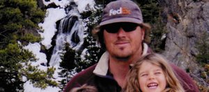 Brian 'Tigger' Stothart's wife, Valerie, describes him as a family man. Stothart holds his children, Samuel and Sophia, at Fish Creek Falls in May. This photo hangs on a tree along the Encampment River in Wyoming.