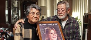 Paul and Mona Blee hold a framed poster of their daughter, Marie, who was last seen on Nov. 21, 1979, and reported missing on Nov. 22, when she was 15. The photo used for the poster was a school picture from Hayden High School, and is the last known picture taken of Marie. Before this photo of Paul and Mona was taken, Paul said, “It will be like the family portrait we never had.”