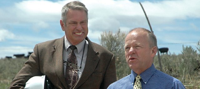 John Boyd, Colorado Northwestern Community College president, left, and Gene Bilodeau, CNCC vice president of administration, speak before a groundbreaking at the college’s new campus site Monday afternoon. The new campus, including an academic building, a career/technical building and a residence hall, is slated to open in the fall of 2011.