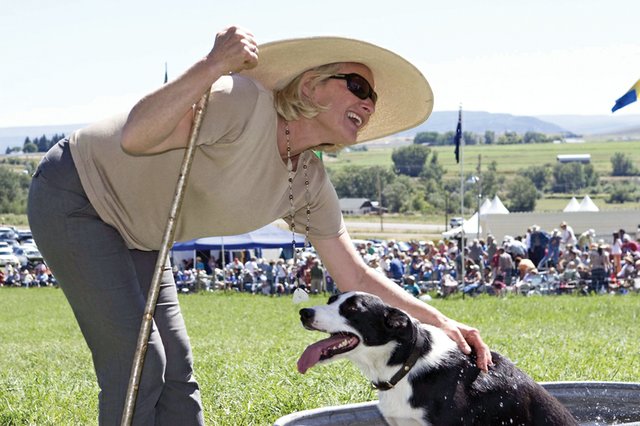 Amanda Milliken, of Kingston, Ontario, Canada, helps her dog and teammate, Ethel, cool off during the 23rd annual Meeker Classic Championship Sheepdog Trials last year. Milliken and Ethel were the overall winners out of more than 120 handler/border collie teams in the event. The 24th annual Meeker Classic is scheduled for Sept. 8 through 12, with numerous contests and entertainment lined up for spectators.