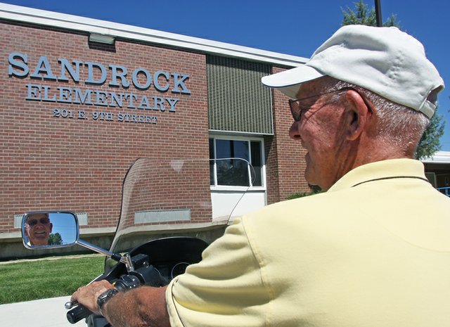 Don Riley takes a long look at the entrance of Sandrock Elementary School, where he will serve as interim principal later in the year. The building, which has undergone numerous name changes, is where Riley began teaching in Craig in 1964. He retired in 2003 after nearly 40 years as a teacher, assistant principal and athletic director in the Moffat County School District.