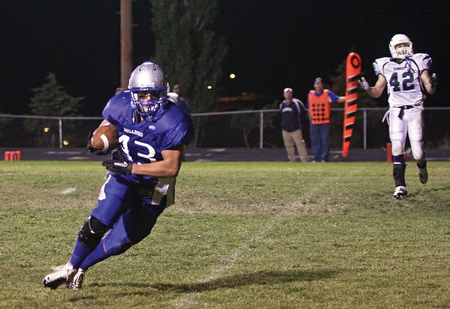 Senior tight end Brady Conner crosses the goal line after a ten-yard pass completion from sophomore quarterback Bubba Ivers to win the game against John F. Kennedy High School in the final minute Friday at the Bulldog Proving Grounds. The Bulldogs came from behind with 1:33 left on the clock to win, 27-20.