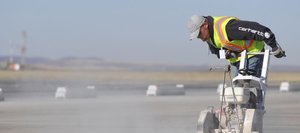 Jason Thomas with Reliable Concrete Cutting works on a new de-icing pad at the Yampa Valley Regional Airport on Thursday. The pad is being built with grant money the airport received.