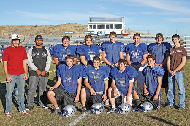 Seniors on the Moffat County High School Bulldogs football team take a break from a Thursday practice. In the front row, from left, are: Cody Adams, Gage Spears, Steven Wagner and Zach Raftopoulos; in the back row, from left, are: Chet Harvey, Casey Martin, Drake Mullen, Michael Pankey, CJ Walt, Hodge Raftopoulos, Brady Conner and Nathan Chapman. The seniors hope to lead their team to the first victory against rival Steamboat Springs since 2004 tonight at Bulldog Proving Grounds Stadium.
