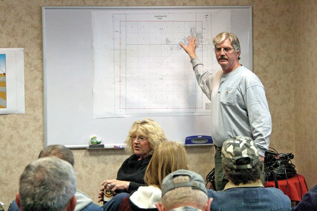 Brent Jacobsen, a project manager for Geokinetics, points to a property map of Craig during a question-and-answer session Saturday at the Holiday Inn of Craig. Geokinetics intends to perform a geologic survey of Craig and parts of Moffat County, and is seeking permission from residents to place seismic sensors on private land. The survey could identify pockets of oil and natural gas.