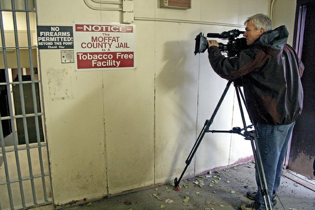 Freelance photographer Carl Filoreto, of Golden, shoots footage Tuesday in the old jailhouse near the Moffat County Courthouse. Filoreto is in Craig on assignment for an upcoming Dateline NBC special. The special, tentatively titled “Heaven’s Rain,” recounts the story of two fugitives who were apprehended north of town in 1979.
