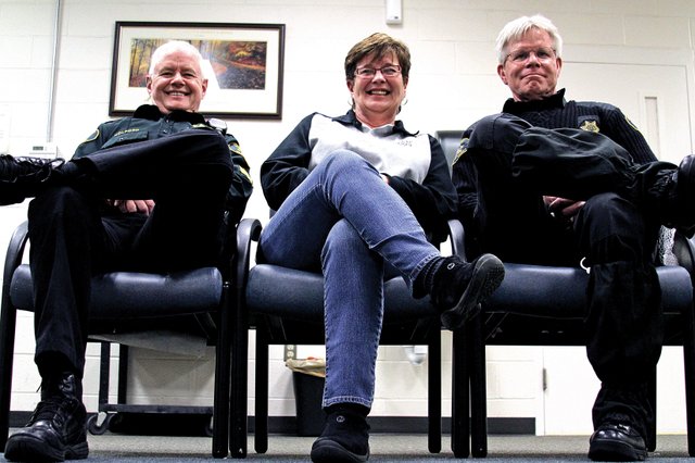 From left, Moffat County Sheriff’s Office patrol sergeant Rick Holford, administrative assistant Nancy Hettinger, and deputy Thomas “Skip” Duncan sit at the Moffat County Public Safety Center. Holford and Duncan recently were awarded for completing their 30th year of service and Hettinger was awarded for completing her 31st.