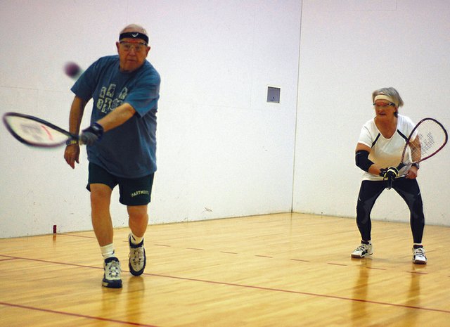 Bill Muldoon, left, serves during a recent game of racquetball with Sue Eschen at Trapper Fitness Center. Muldoon, a 75-year-old Craig resident, and Eschen, 63, both placed fourth at the World Senior Games in Utah, qualifying them for the Senior National Racquetball Championships in June in Houston.
