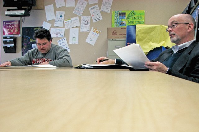Moffat County School District administrators Mark Rydberg, left, and Joe Petrone present their draft budget proposal for fiscal year 2012 to students of Moffat County High School. The proposal calls for $2.3 million in reductions district wide, and includes a redistribution of 45 students from Sandrock Elementary School to Ridgeview Elementary School and reductions in bus routes.