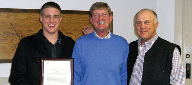 Congressman Scott Tipton, R-Cortez, middle, stands Feb. 22 in the Moffat County Courthouse with Angelo, left, and John Raftopoulos. Tipton read a tribute to the former Moffat County Commissioner Marianna Raftopoulos into the Congressional Record, then presented a transcript of the record to the Raftopoulos family.