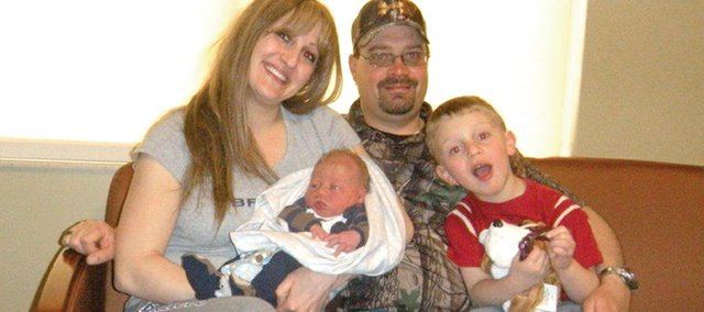 Traci Curtis, left, holds her newborn son, Parker, with her husband Mark-Lee and oldest son Tucker, 4, at The Memorial Hospital in Craig. Traci and Mark-Lee, residents of Baggs, Wyo., were forced to deliver Parker on April 17 on the side of Colorado Highway 13 near mile marker 104 as they could not make it to TMH in time. Both said it was an experience they’ll never forget.