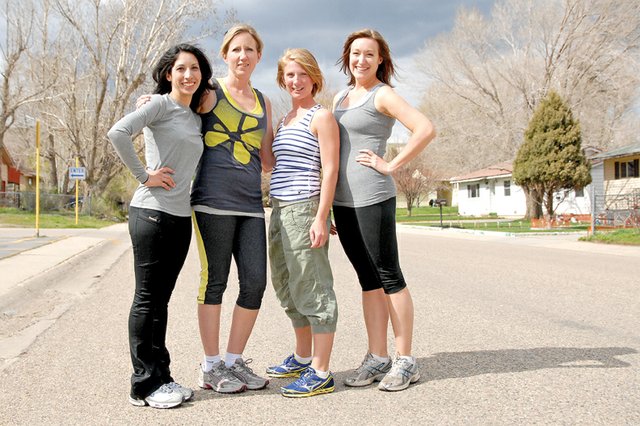 From left, Isis Beckett, Kristin Allen, Kara Schrimsher and Lindsay Anderson stand Thursday afternoon outside of Sunset Elementary School. The four women will host the first run for the Sole Sisters Women’s Running Club on Saturday for women interested in running or who simply want to get out of the house. The club will meet at 8:15 a.m. at Sunset Elementary School.