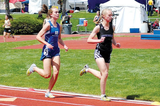Maddy Jourgensen, left, competes in the 3,200-meter run Friday during the 4A state meet at Jeffco Stadium in Lakewood. The Moffat County High School senior took third in the race with a time of 11 minutes, 15.22 seconds. Jourgensen’s time also beat out Christina Moyer’s 1997 MCHS record of 11 minutes, 20.56 seconds.