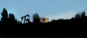 Oil extraction equipment is silhouetted on a ridgeline that runs alongside U.S. Highway 40 just outside of Milner in western Routt County. Routt County planner Chris Brookshire said three companies — Quicksilver Resources, based in Fort Worth, Texas; SWEPI, a subsidiary of Shell Oil; and True Oil, based in Casper, Wyo. — have inquired about the process in the past two months.
