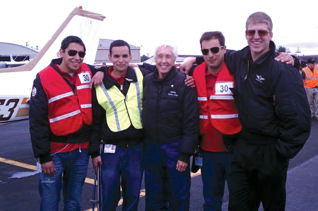 Members of the Colorado Northwestern Community College flight team pose last week during the National Intercollegiate Flying Association’s SAFECON 2011 national competition at Ohio State University. From left are Torbyn Cabral, Cordero Valdez, safety judge Wally Funk, James Segrest and Marcus Kindall. CNCC’s flight team took 13th overall at the competition and topped the two-year aviation program rankings.