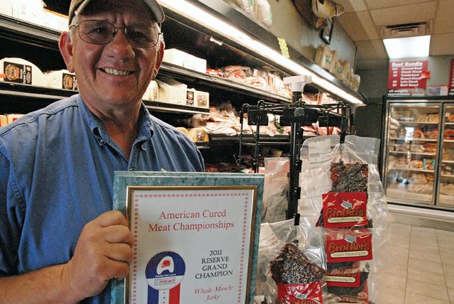 Dave Satterwhite, co-owner of Brother’s Custom Processing, Inc.., holds Friday a plaque for his store’s award-winning beef jerky. From June 15 to 18, Satterwhite attended the American Cured Meat Championships in Reno, Nev. The event was organized by the American Association of Meat Processors.. Brother’s won reserve grand champion for whole muscle jerky.