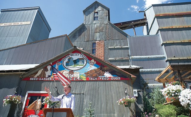 Gov. John Hickenlooper speaks to the crowd about economic development Friday afternoon in front of Yampa Valley Feeds in Hayden. The governor presented “Colorado Blueprint: A bottom-up approach to economic development,” an outline of steps he plans to take the next few years to support economic development.