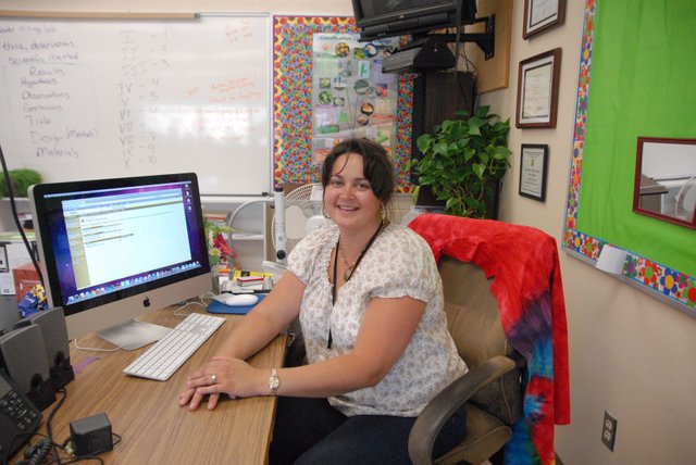 Amber Clark, a Moffat County High School science teacher, sits next to her computer displaying Alpine Achievement, a program the Moffat County School District rolled out this fall. The program, which costs about $16,000, allows teachers to see results from multiple tests, including the Colorado Student Assessment Program.