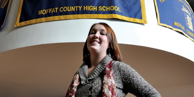 Kirstie McPherson, a Moffat County High School senior, stands underneath the banner for the school’s National Honor Society, of which she is a member. McPherson, 18, also is involved in the MCHS Distributive Education Clubs of America, Key Club and Stopping Abuse Forever, or SAFE, which works in partnership with Advocates-Crisis Support Services.