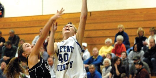 Makayla Camilletti, a Moffat County High School junior, puts up a lay-up against an Eagle Valley defender Jan. 13 at MCHS. The MCHS girls varsity basketball team won its first encounter with Eagle Valley, 57-27, and head coach Matt Ray said if his team plays fundamentally sound on both sides of the ball today, the Bulldogs should score another victory over the Devils.