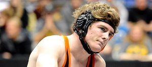 Hayden senior Chad Terry sits on the mat after his 17-14 loss in the Class 2A state wrestling finals Saturday in Denver.
