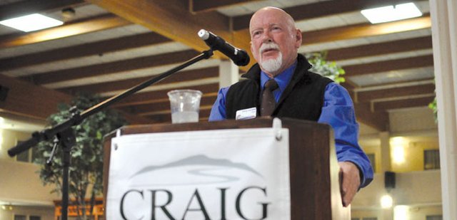 Craig Mayor Terry Carwile addresses the audience Friday during his State of the City address, one of several speeches offered during the annual State of the County event at Holiday Inn. Sales tax revenues are up, but city officials are still approaching the 2012 budget with “cautious optimism,” he said.