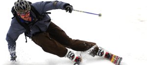 Bill Murphy cuts a sharp corner to make the finish line Saturday during Cody’s Challenge at Steamboat Ski Area. The fourth annual event drew more than 70 skiers and snowboarders.