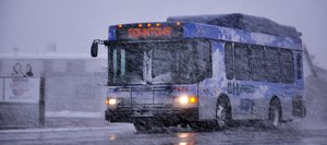A Steamboat Springs Transit bus drives through wind and snow Sunday near the intersection of U.S. Highway 40 and Routt County Road 129. One of the city's hybrid diesel buses will be on display Monday in the Depot Art Center parking lot during an expo showcasing vehicles that utilize alternative fuels.