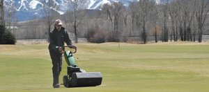 Steamboat Golf Club Superintendent Andy Keyek mows the No. 9 green Wednesday afternoon at the west Steamboat Springs golf course. The course is scheduled to open for the season Thursday morning.