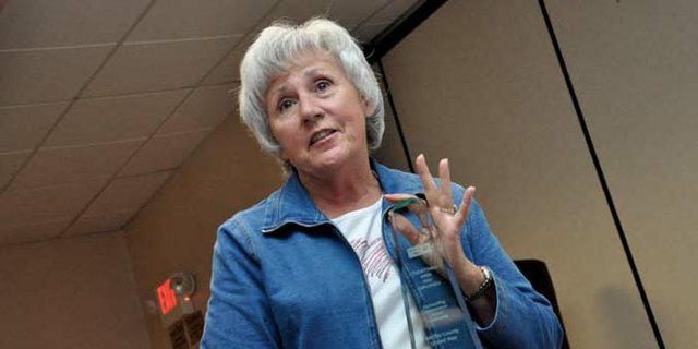 Bonnie Hampton, former Moffat County United Way board member and recently retired Twentymile Coal Mine employee, accepts an award on the company’s behalf during an awards luncheon Wednesday at the Holiday Inn of Craig. Twentymile was the pacesetter for the 2012 United Way campaign and raised nearly $80,000 through employee contributions and matching company donations.