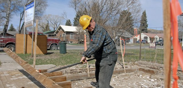 Neil Folks, president of the Moffat County Fuller Center for Housing, pulls floor boards Wednesday from a condemned structure at 731 Yampa Ave. Once rebuilt, the new structure will be repurposed for low-income housing. The Fuller Center needs volunteers to continue the project. A volunteer work weekend is scheduled for 9 a.m. to 6 p.m. April 14 and 15. For more information, call Folks at 326-8726.