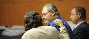 Routt County Public Defender Sheryl Uhlmann talks to her client Robert Cash on after he was sentenced Friday to 38 years in prison for attempting to murder his former wife, Rhonda Heaton, on June 11, 2010, at their west Steamboat Springs home.