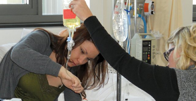 Katie Testa, left, a nursing student at Colorado Northwestern Community College’s Craig campus, completes an IV lab in January as nursing instructor Amy Schaus looks on in this photo provided by CNCC Nursing Program Director Kelly Martin-Puleo. The director received word Monday that the program was accepted for accreditation through the National League for Nursing Accrediting Commission.