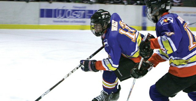Jarret Walt, a Moffat County High School junior, skates with the puck last week while playing for the Colorado Ski Country Selects youth hockey team in Switzerland. Walt said the players in Switzerland played the game with more finesse and less physicality, with about five times more penalties being called on the Selects than the Switzerland squads.