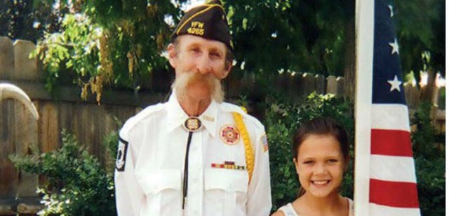 Dan McIntyre stands with his granddaughter, Lanie, in this photo taken recently outside his Craig home. Dan was a decorated Vietnam veteran who received the Purple Heart and Bronze Star during a 13-month tour of duty with the U.S. Army. He is remembered by his family as a devoted husband, caring father, and dedicated volunteer with St. Michael’s Community Kitchen.