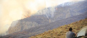 Routt County Sheriff’s Office Sgt. Doug Scherar watches Tuesday as a wildfire spreads at a ranch along Routt County Road 31 in the southern part of the county. Sheriff Garrett Wiggins estimated the fire had burned 200 acres and was not under control as of Tuesday evening.