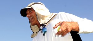 Steamboat Springs High School boys tennis coach John Aragon feeds balls onto the court during practice in August in Steamboat Springs. The boys tennis program is one of the Tier 2 sports that are in danger of losing funding because of a projected $30,000 athletics transportation deficit.