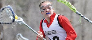 Steamboat’s Nikki Fry is surrounded by Fruita-Monument defenders Saturday as she rushes downfield. She managed to score on the play, but it was a tough day for the Sailors, who lost, 13-5.