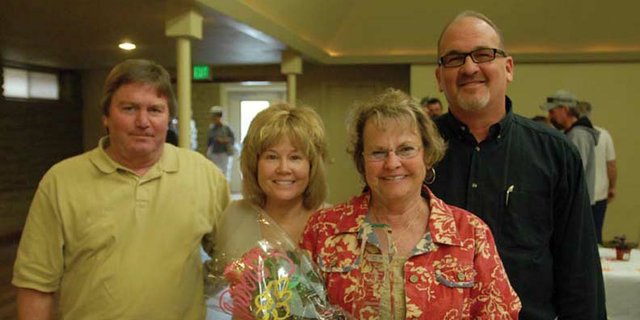 Moffat County United Way’s 2011 Volunteer of the Year Gail Severson, second from right, holds up her award alongside Jim Ferree, left, Corrie Ponikvar and Joe Bird at the Moffat County Fairgrounds Pavilion. Severson received the community award Wednesday for her years of service to Craig and Moffat County.