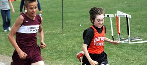 Soroco’s Chance Beatty and Hayden’s Christopher Carrouth race for the finish line at the end of the 1,600-meter run. Chance won that sprint, winning the eighth-grade boys race. Christopher was second overall but easily hung on to take first among sixth-graders Wednesday at a middle school track meet in Hayden.