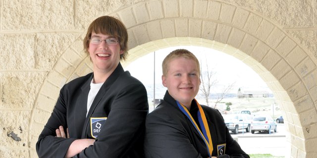 Moffat County High School seniors Adam Foster, left, Thomas McCoy, pictured here at the high school, depart Saturday for a national Distributive Education Clubs of America competition in Salt Lake City. They are the first students in MCHS history to qualify for national events in both DECA and Future Business Leaders of America.