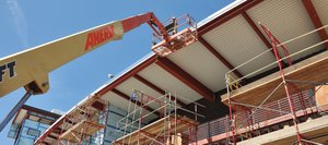 Piotr Marek works on the roof of the new academic facility Monday at Colorado Mountain College’s Alpine Campus. Campus CEO Peter Perhac said construction on the building is three weeks ahead of schedule.