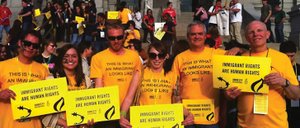 Local Amnesty International chapter members, including, from left, Kyle Hornor, Ashley Carson, Chris Jiggens, Molly Goldberg, Bob Gumbrecht and Larry Haines, recently attended a protest in Denver to advocate immigrant rights. The groups are holding a fundraiser at 7 p.m. Thursday at The Tugboat Grill & Pub.