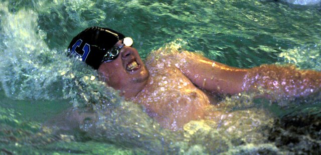 Moffat County High School senior John Kirk powers through the water during the 100-meter backstroke event at the Moffat County Invitational Friday afternoon at the Moffat County High School pool. Kirk placed sixth in the backstroke and first in the 400-meter freestyle. The MCHS boys varsity swim team took third in the home meet.