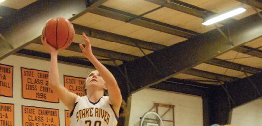 Morgan Wille, a Little Snake River Valley (Wyo.) School senior, puts up a lay-up during a January 2012 game against Hanna-Elk Mountain in Baggs, Wyo. Wille will represent Baggs in multiple basketball tournaments over the summer, including the Wyoming vs. Montana All-Star event. She will also be playing basketball as a freshman for Sheridan College.